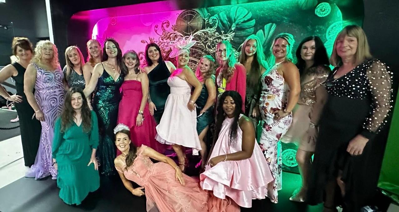 Mandie's Tropic team celebrating together at a glamorous event